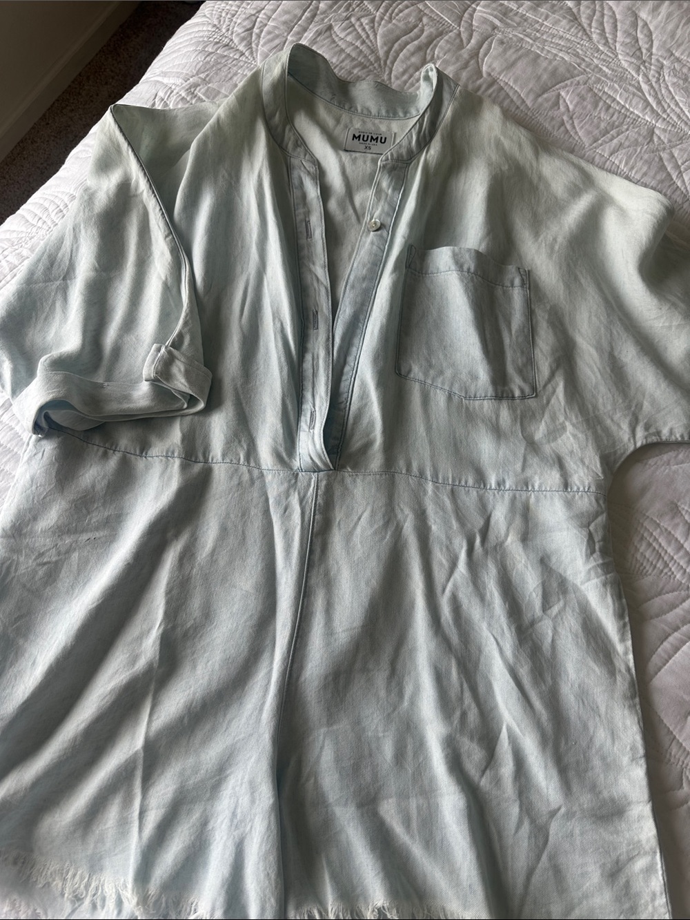 Show Me Your MuMu soft chambray Short Sleeve Button-Down romper with frayed edg